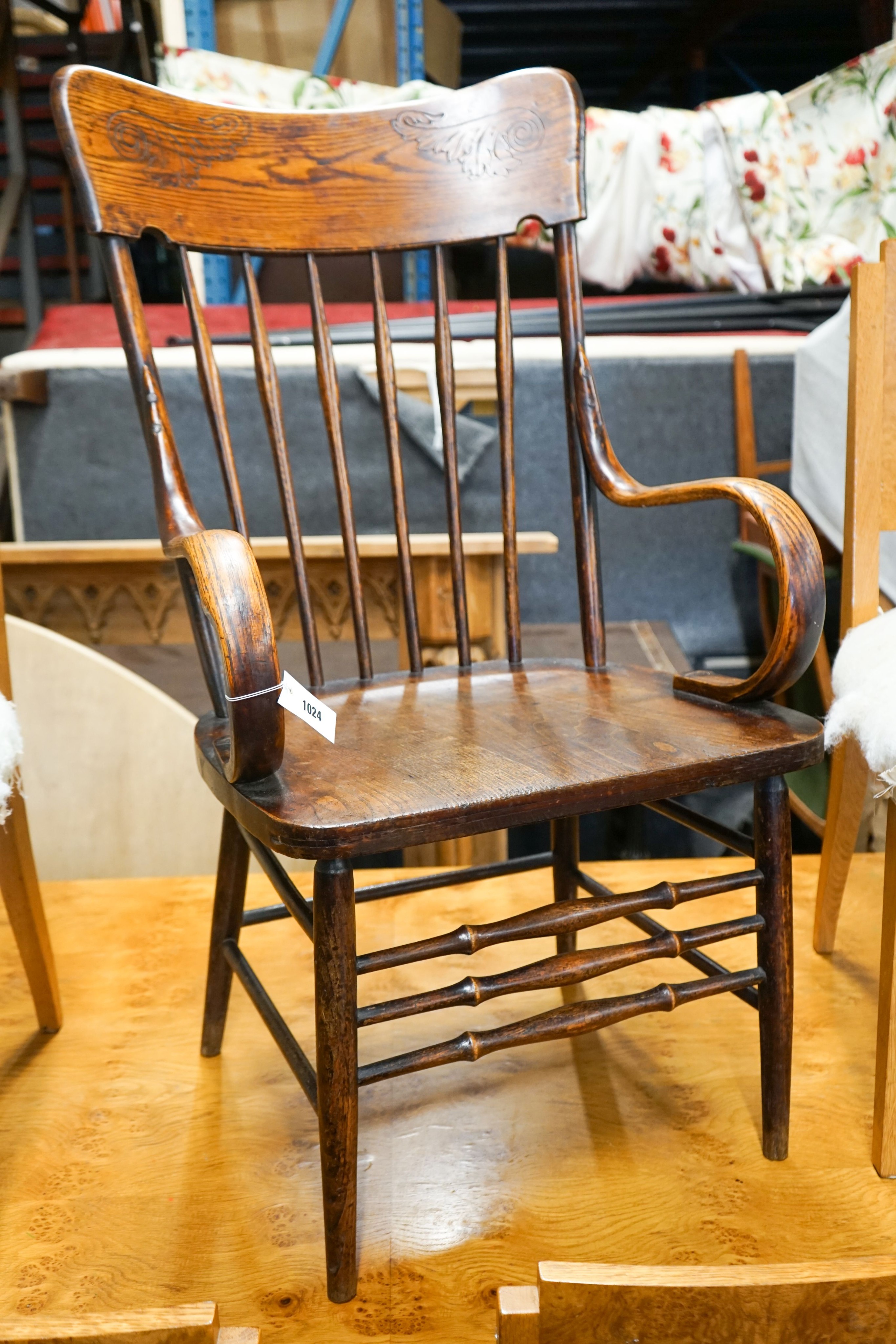 An early 20th century American elm and beech comb back armchair, width 57cm, depth 48cm, height 106cm